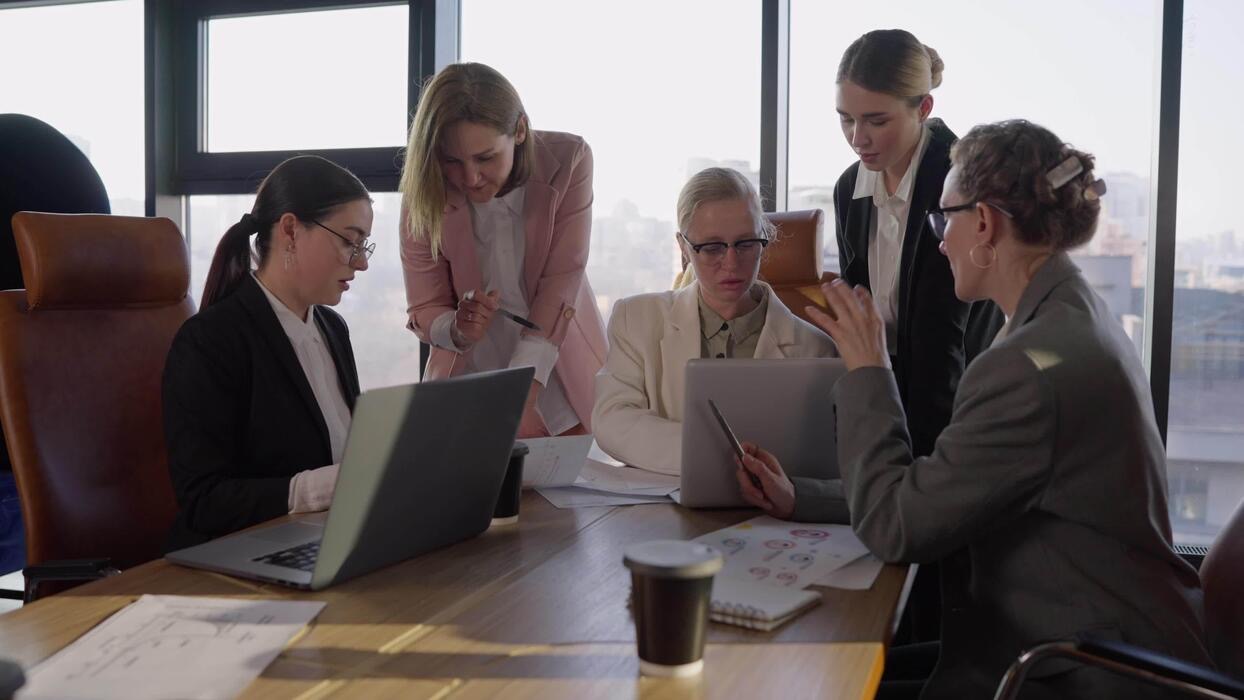 Leadership team planning around a boardroom table
